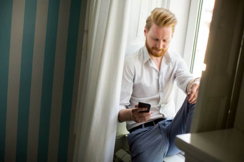 When a man hides his phone, He goes outside to receive calls all the time.